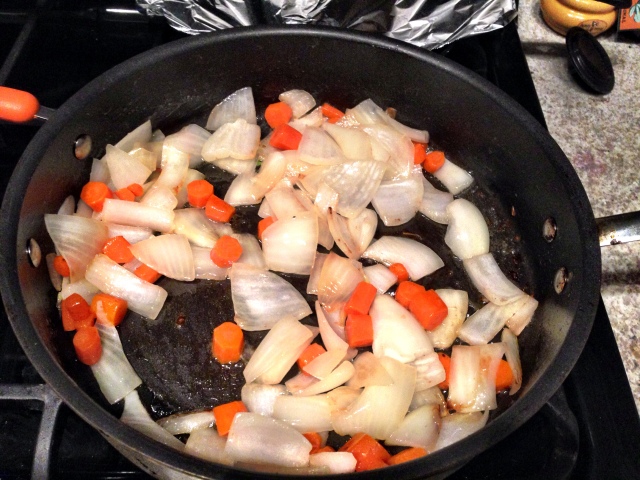 Onions and carrots sweating for chicken pot pie
